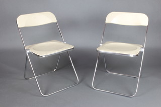 Castelli, A pair of mid 20th Century chrome and white plastic folding chairs 
