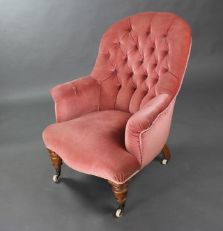 A Victorian tub back armchair upholstered in rose pink buttoned dralon 