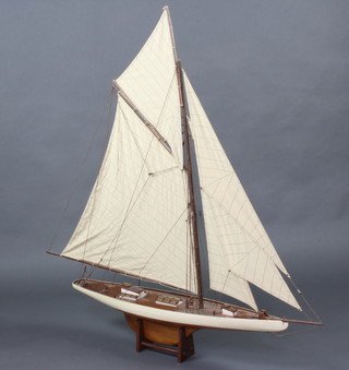 A reproduction model pond yacht and stand 123cm h x 117cm l x 80cm d 