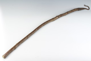 A 19th Century iron crook with 6.5cm head raised on a wooden shaft