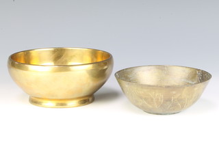 A circular bronze bowl 5cm x 13cm and an Eastern circular engraved gilt metal bowl 3cm x 11cm 