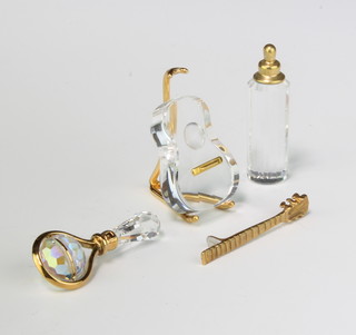 Three Swarovski Crystal classics - scent bottle 3.5cm, babies rattle 3.5cm and guitar and stand 6cm, boxed 