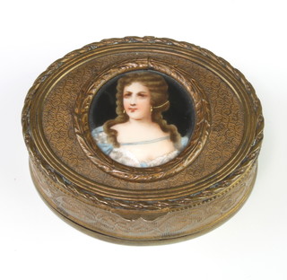 A 19th Century oval gilt metal trinket box the lid decorated a porcelain portrait of a lady 3cm x 7cm x 5 1/2cm 