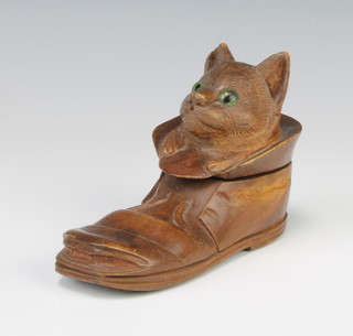 A Victorian carved wooden model inkwell in the form of a shoe with cat emerging from the top set hardstone eyes 9cm h x 13cm w x 5cm d 
