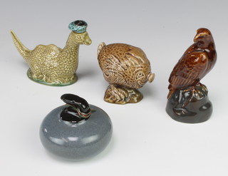 A novelty Carltonware whisky flask in the shape of a curling stone, 2 Beswick do. in the form of a haggis and an eagle, a Wade do. Loch Ness Monster 