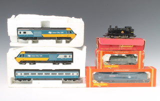 A Triang R52 tank engine boxed, a Hornby OO Great Western Railway tank engine boxed, A Hornby R420 BR Class 37 diesel boxed and a Hornby Intercity 125 train set 
