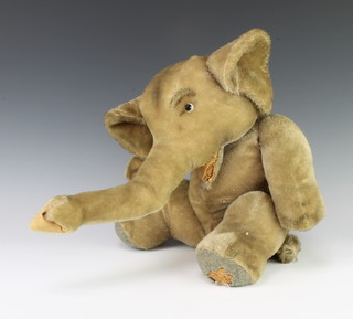 A Steiff figure of a seated elephant 41cm x 30cm x 16cm 