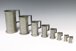 A set of 7 19th Century cylindrical Continental pewter measures 