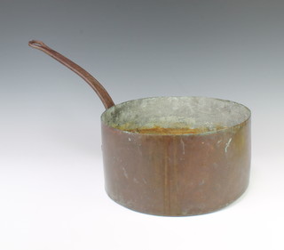 A copper saucepan with iron handle marked BAI 15cm x 29cm 