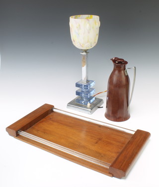 An Art Deco chrome and glass table lamp with opaque glass shade raised on a square base 40cm h x 12cm x 12cm, a brown Bakelite Thermos jug the base marked Thermos (1925) 25cm h x 11cm  and a walnut and glass twin handled tray 4cm x 47cm x 24cm 
