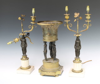 A 19th Century bronze and gilt metal oil lamp base in the form of a pierced basket supported by 3 classical ladies standing on a circular base with bun feet 40cm x 20cm (oil lamp missing) together with a pair of bronze and gilt metal twin light candelabrum supported by bronze figures of standing ladies raised on "marble" bases converted to electric table lamps 53cm h x 11cm x 11cm (1f)