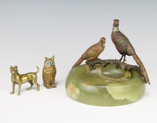 An Art Deco turned onyx ashtray decorated a cold painted bronze figure of a hen and cock pheasant (figures f) 10cm x 11cm diam. together with a bronze figure of a standing owl 5cm and a gilt metal figure of a standing dog 4cm x 4cm 
