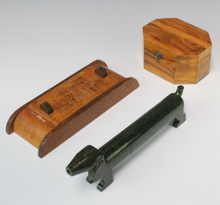 An Art Deco green Bakelite pencil case in the form of a sausage dog, the nose fitted a pencil sharpener 8cm x 25cm x 3cm together with an olive wood lozenge shaped box 7cm x 13cm x 10cm and an oak arch shaped trinket box 3cm x 24cm x 9cm 