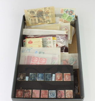 A collection of Victorian and later used GB stamps including a penny black, 3 tuppenny blues, penny reds, etc 