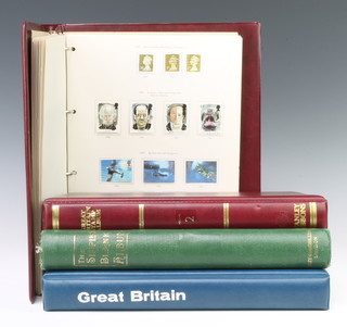 A Simplex green album of George VI to Elizabeth II GB stamps, volumes 2 and 3 Stanley Gibbons GB stamps Elizabeth II 1970 to 1991 and onwards together with an empty GB stamp album  