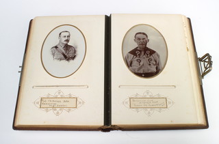 A Victorian leather bound photograph album containing various black and white portrait photographs of members of the Royal West Kent Regiment 