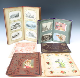 2 albums of black and white and coloured postcards together with 1 volume "Picturesque Devonshire", a Victorian scrap album and 1 vol. "Sixty Years a Queen" 