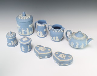 A Wedgwood blue Jasperware biscuit barrel and cover, do. teapot, 2 lidded jars, 2 heart shaped boxes and 2 jugs