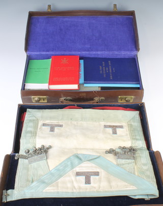 Of Masonic Interest, 2 attache cases containing a Royal Ark Companions apron and sash, a Royal Ark Mariners Past Commanders apron and collar, a Mark Master Masons apron, a Worshipful Masters apron together with a collection of various books relating to Free Masonry 