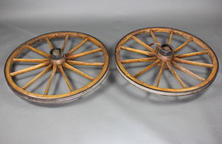 A pair of 19th Century elm 12 spoked metal shod cart wheels 94cm diam. (missing rubber tyre) 