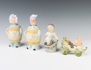 A pair of German bisque figures of a lady and gentleman wearing barrels with nodding heads 18cm, a ditto figure of a boy climbing into a bath and a group of pigs driving a carriage