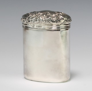 An Edwardian silver mounted oval toilet jar with repousse lid London 1903 and plated base 10cm 