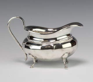 A silver cream jug with S scroll handle on hoof feet Sheffield 1962 maker Viners , 202 grams
