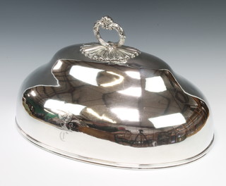 A Victorian oval silver plated meat cover with scroll handle and engraved crest maker T & J Creswick 28cm H 33cm W 50cm D