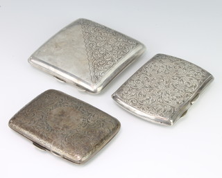 A silver cigarette case Birmingham 1918, 2 others, 263 grams