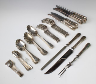 A canteen of silver cutlery with reeded decoration comprising 8 coffee spoons, 8 tea spoons, 8 dessert spoons, 8 soup spoons and 4 table spoons, 8 dessert forks, 8 dinner forks, 8 dessert knives, 8 dinner knives, a 3 piece carving set, Sheffield 1980 maker James Dixon & Sons  2699 grams 