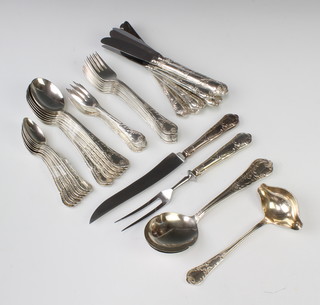 An 800 standard cutlery set comprising 8 tea spoons, 9 dessert spoons, 9 cake forks,  9 dinner forks, a sauce ladle, 2 serving spoons, 9 knives and a carving set 1870 grams