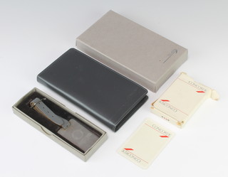 A Concorde silver luggage tag, a diary and pack of playing cards 