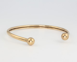 A 9ct yellow gold bangle, gross 6.49 grams 