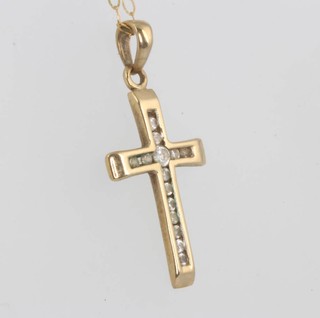 A 9ct yellow gold cross pendant and a do. bracelet 2.4 grams
