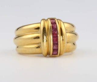 An 18ct yellow gold princess cut ruby ring size R 