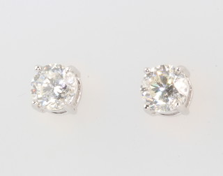 A pair of 18ct white gold single stone ear studs 1.07ct 