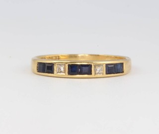 An 18ct yellow gold sapphire and diamond ring size n 1/2