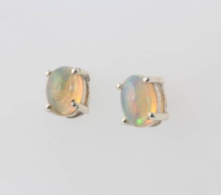 A pair of Ethiopian opal stud earrings approx 1.2ct 