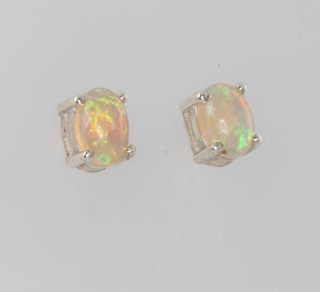 A pair of silver Ethiopian opal ear studs 1.4ct 