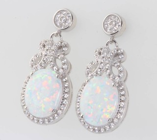 A pair of silver, cubic zirconia and opalite drop earrings