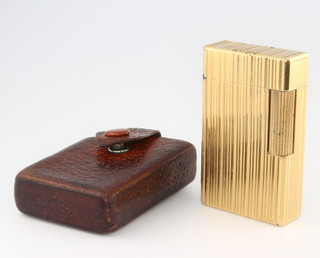 A gentleman's gold painted Dupont gas cigarette lighter in a leather pouch 