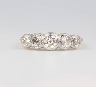 An 18ct yellow gold 5 stone diamond ring 1.55ct size M