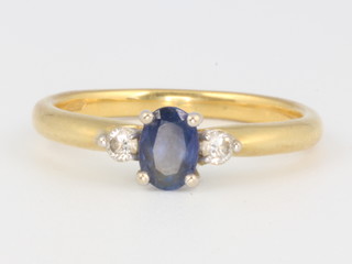 An 18ct yellow gold sapphire and diamond ring size O