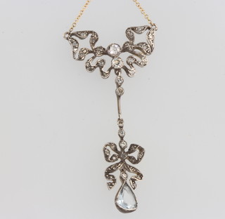 An Edwardian style diamond and aquamarine pendant on an 18ct gold chain 