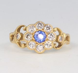 An 18ct yellow gold Victorian style sapphire and diamond ring, the sapphire approx. 0.4ct surrounded by brilliant cut diamonds approx. 0.65ct size N 1/2