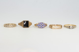 Five 9ct yellow gold gem set rings, size M