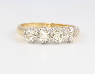 An 18ct yellow gold graduated 4 stone diamond ring 1.2ct, size N 1/2