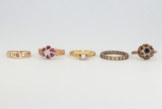 Five 9ct yellow gold gem set rings, sizes M