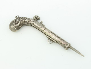 A Sampson and Morden silver toothpick in the form of a flintlock pistol 