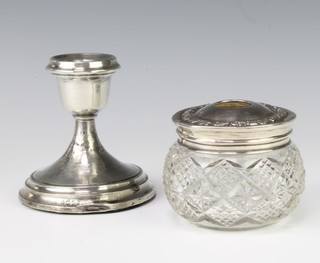 A silver mounted cut glass hair tidy Birmingham 1918 and a ditto candlestick 